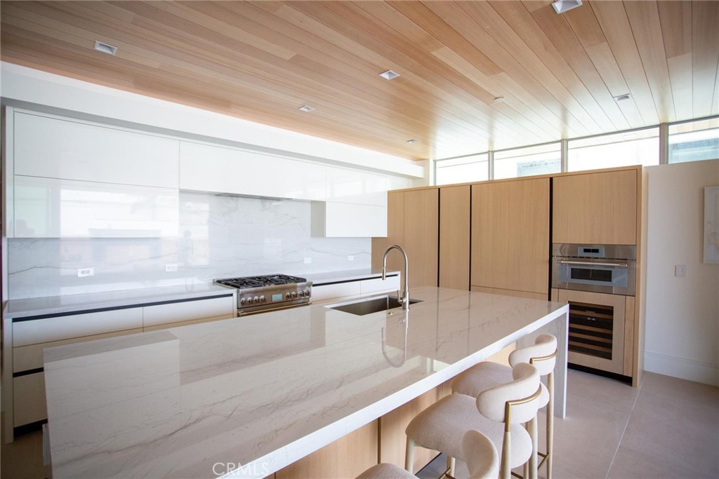a kitchen with stainless steel appliances a stove and a refrigerator