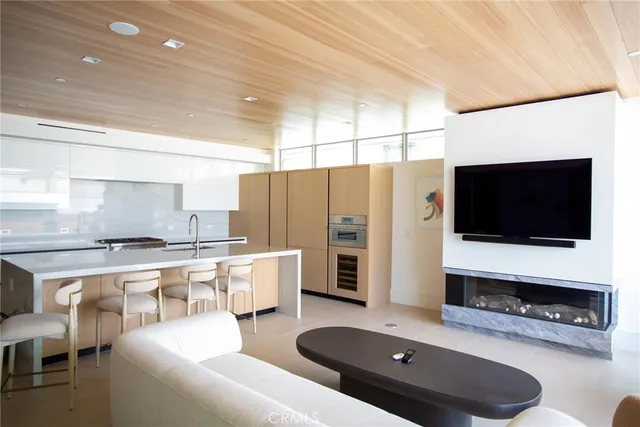 a kitchen with stainless steel appliances a stove a refrigerator a sink and a stove