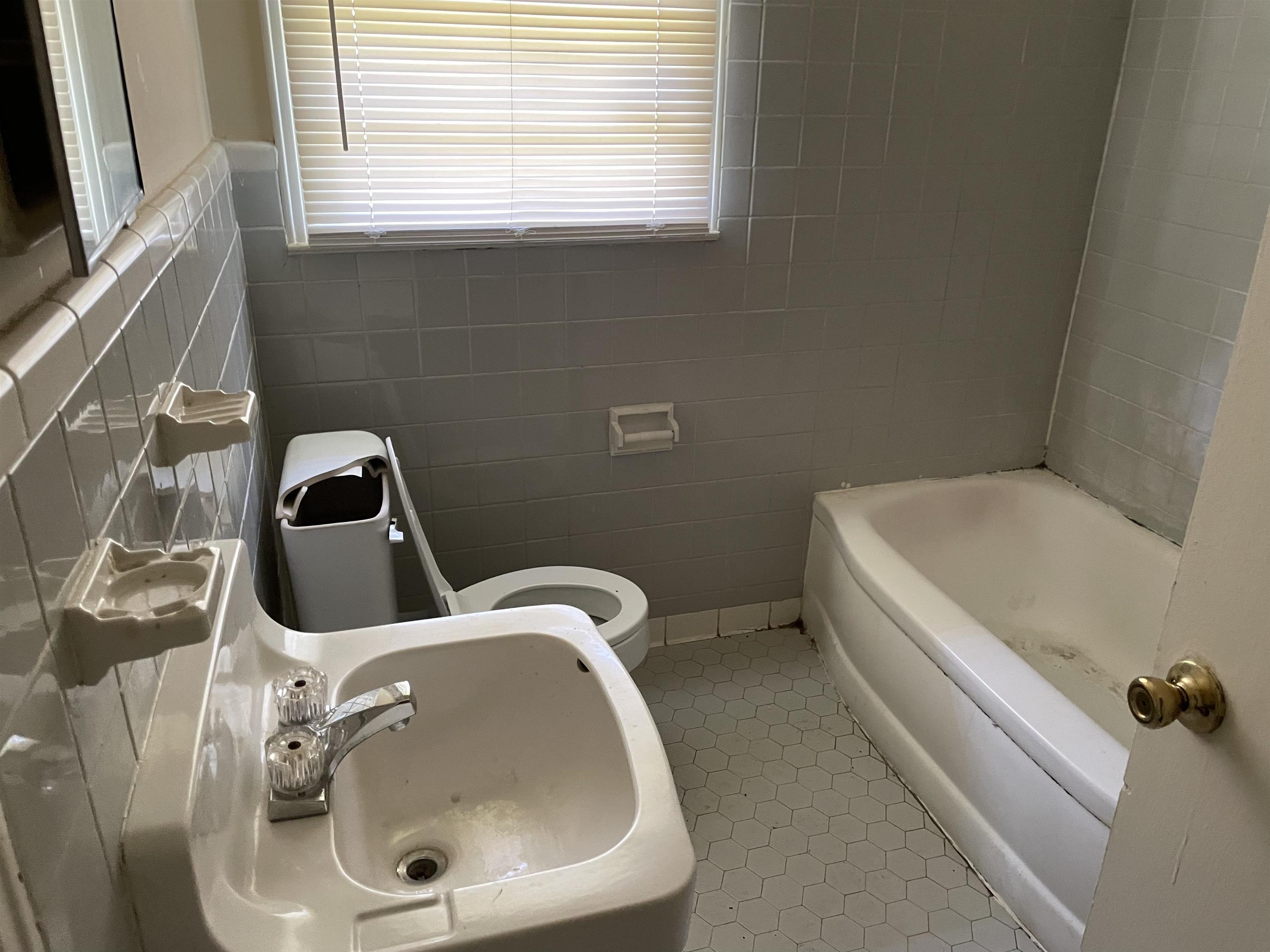 273 Clower Road Memphis, TN 38109 - Photo 12 of 13 a bathroom with a sink and a toilet