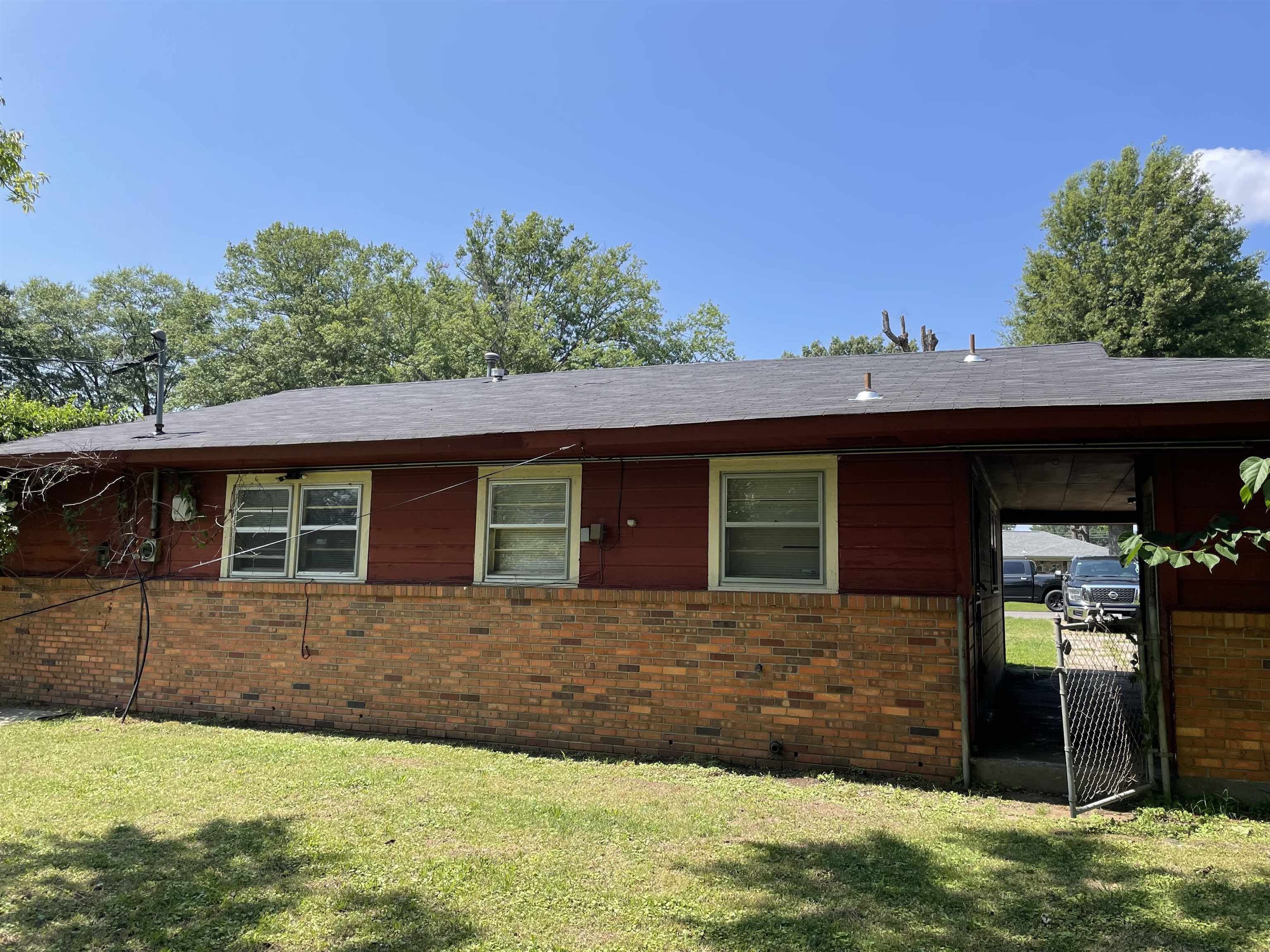 273 Clower Road Memphis, TN 38109 - Photo 2 of 13 a front view of a house with a yard