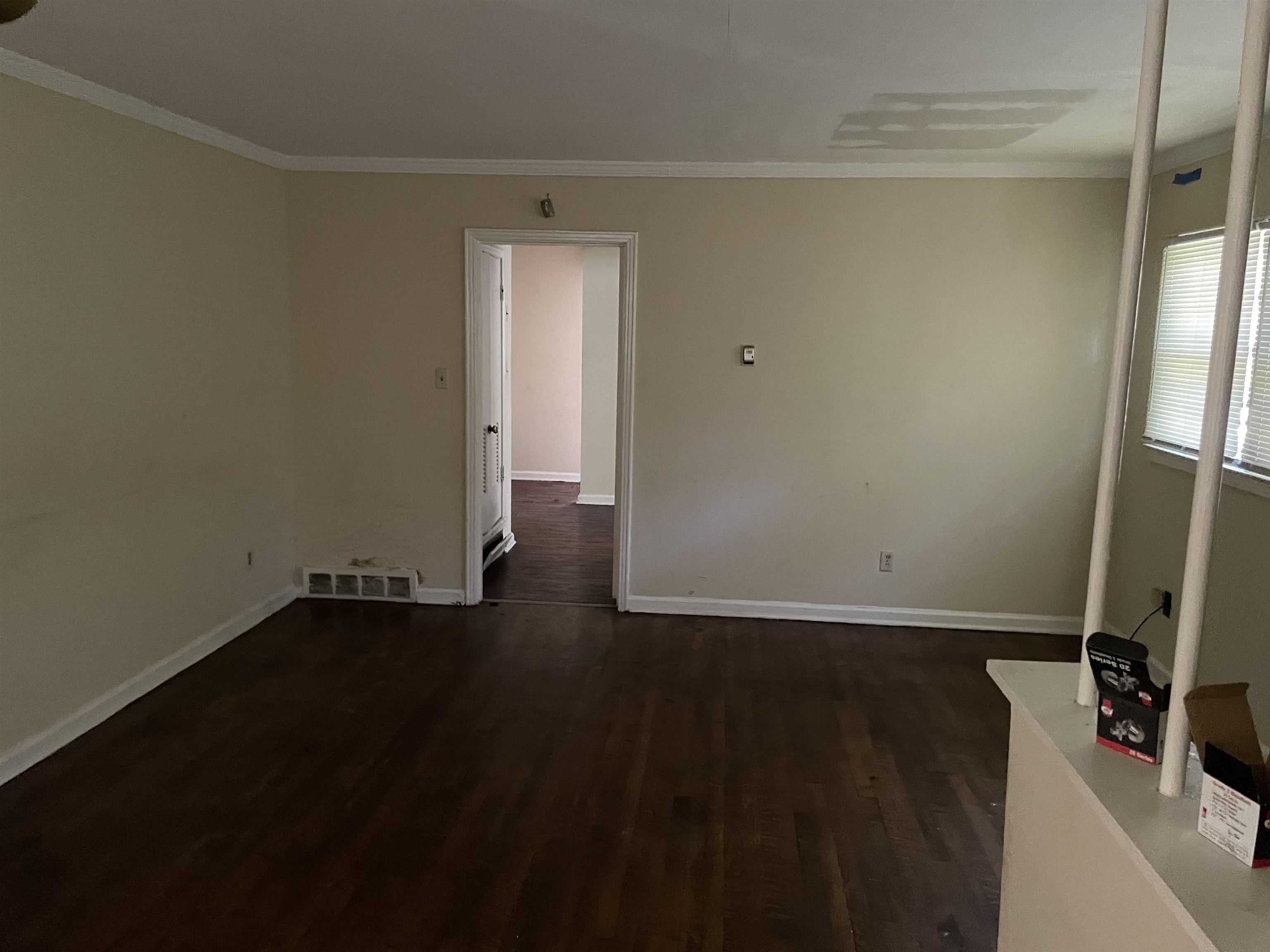 273 Clower Road Memphis, TN 38109 - Photo 3 of 13 a view of a storage & utility room with wooden floor