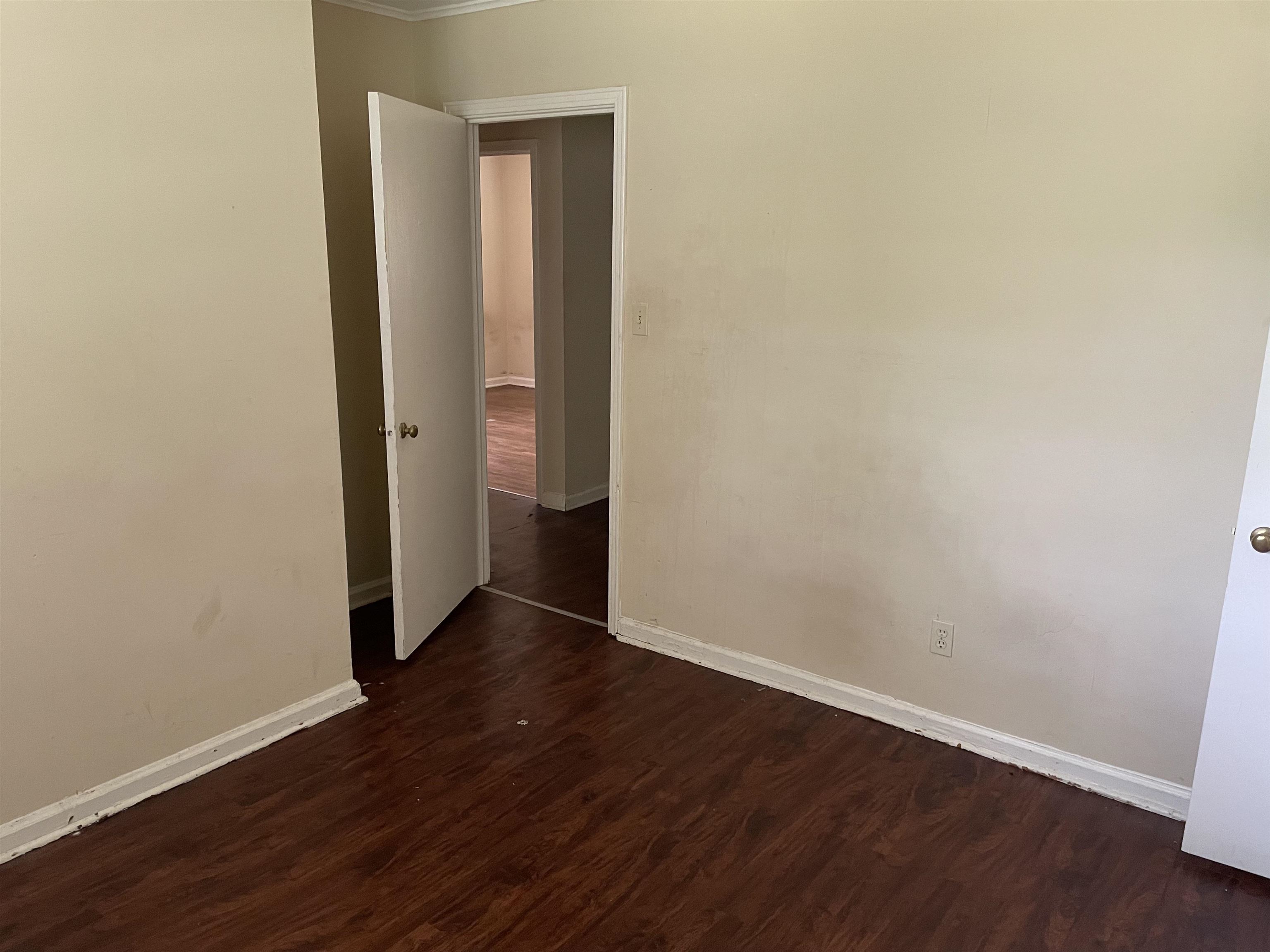 273 Clower Road Memphis, TN 38109 - Photo 7 of 13 a view of an empty room with wooden floor