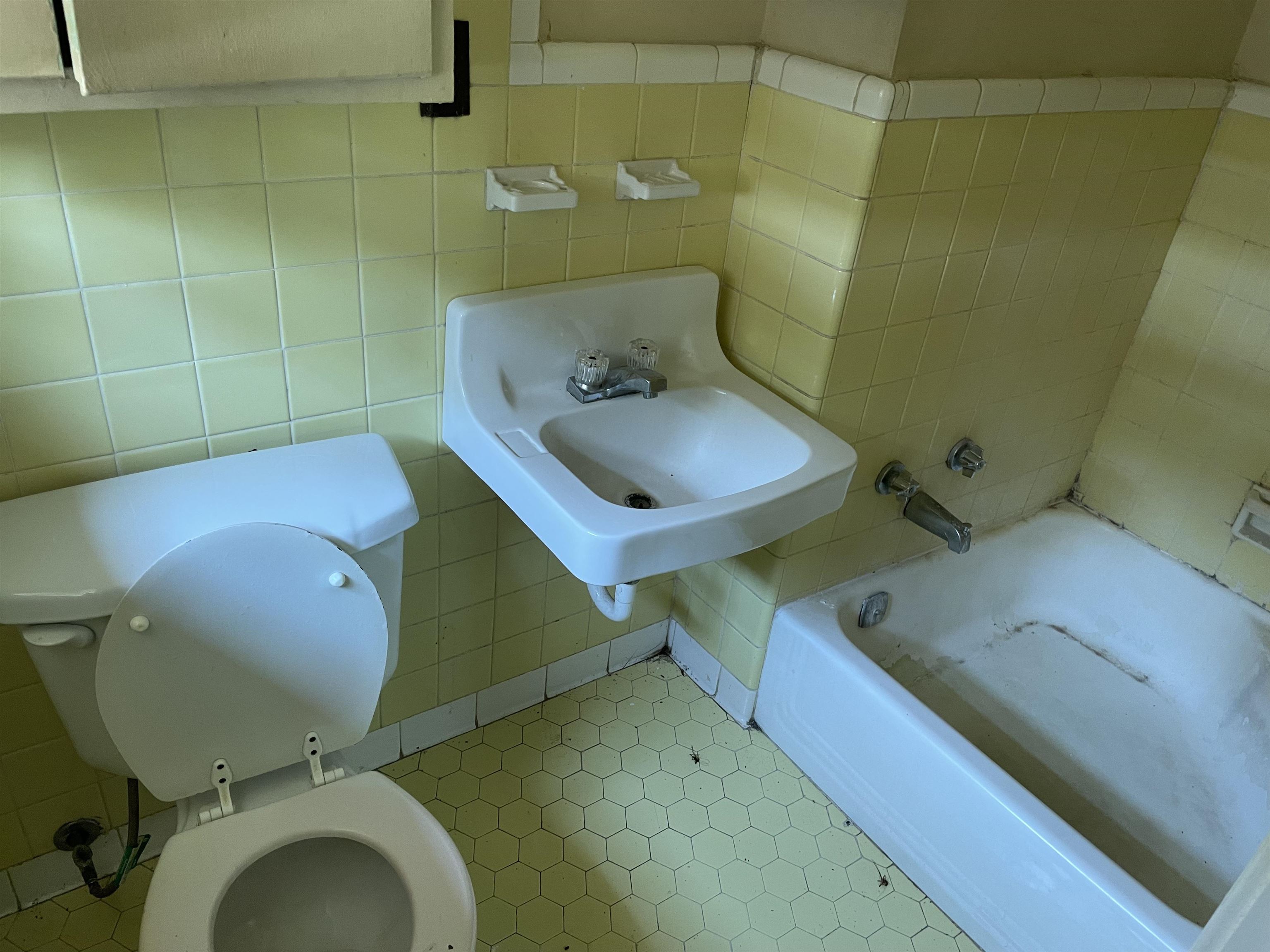 273 Clower Road Memphis, TN 38109 - Photo 10 of 13 a bathroom with a toilet and a sink