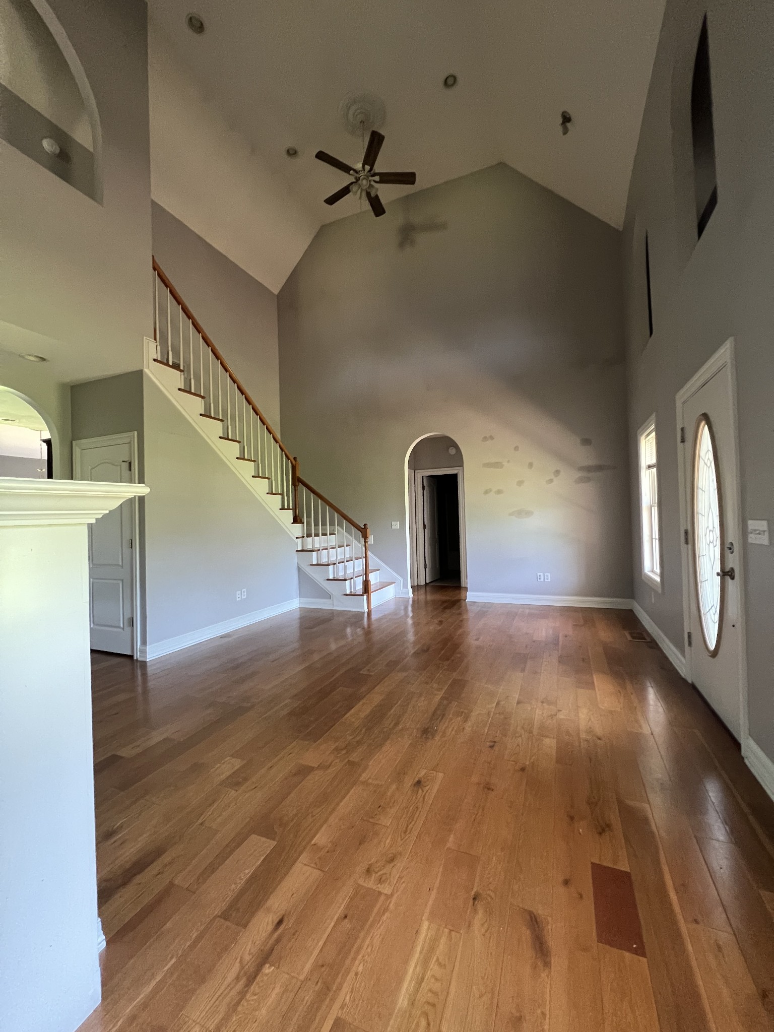 8603 Red Boiling Springs Road Lafayette, TN 37083 - Photo 3 of 34 a view of a livingroom with wooden floor and a ceiling fan