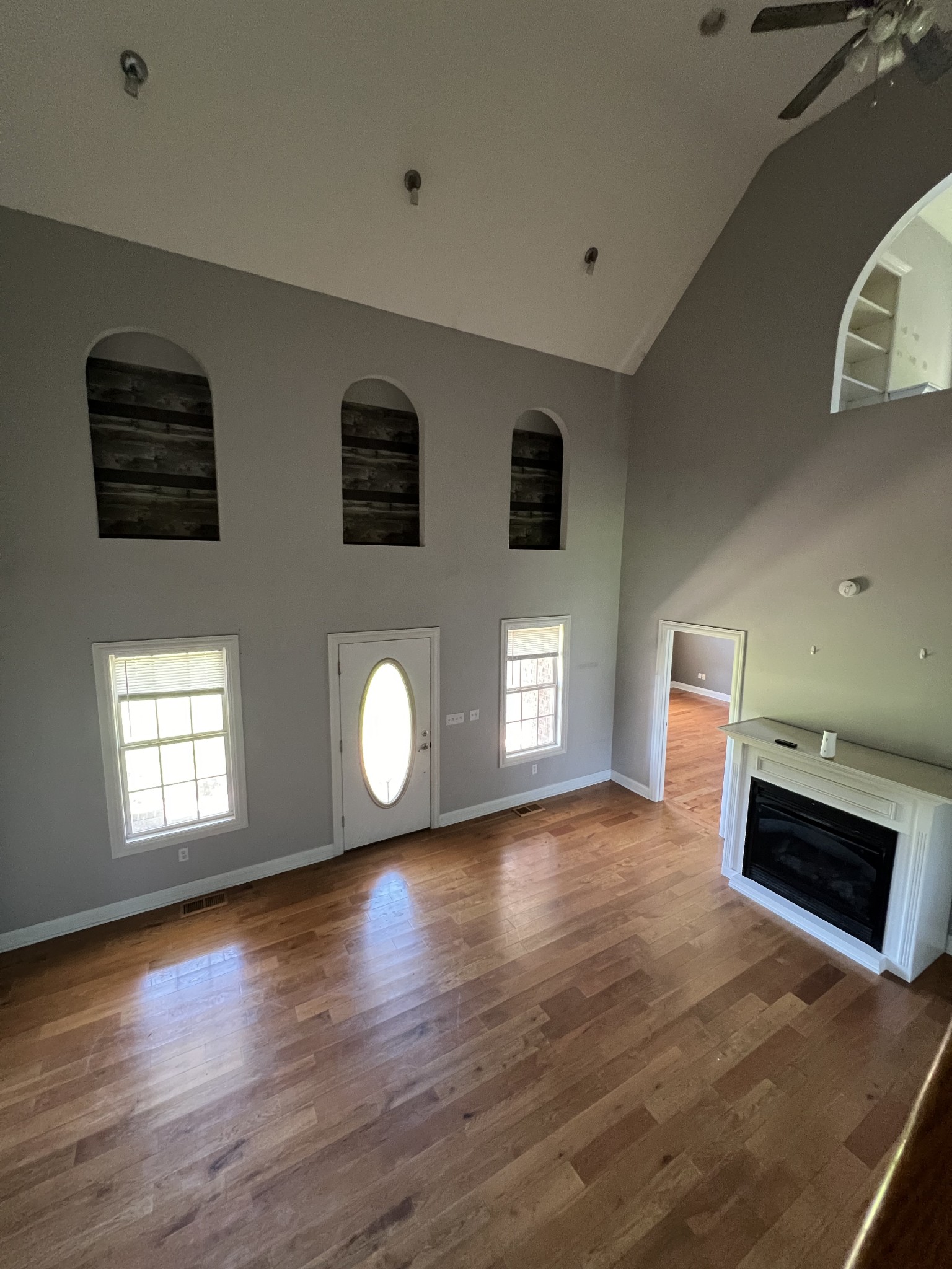8603 Red Boiling Springs Road Lafayette, TN 37083 - Photo 5 of 34 a view of an empty room with wooden floor and a window