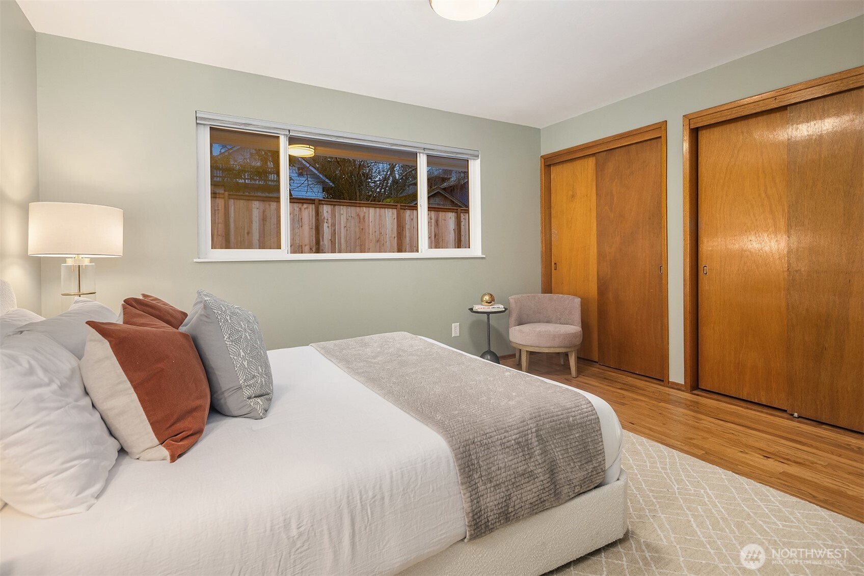 119 North 84th Street Seattle, WA 98103 - Photo 11 of 32 a bedroom with a large bed and a window