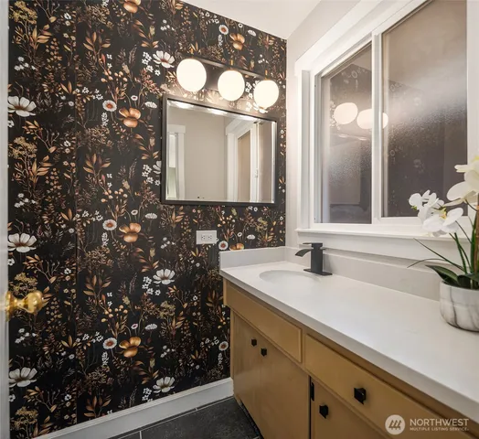a bathroom with a sink and a mirror