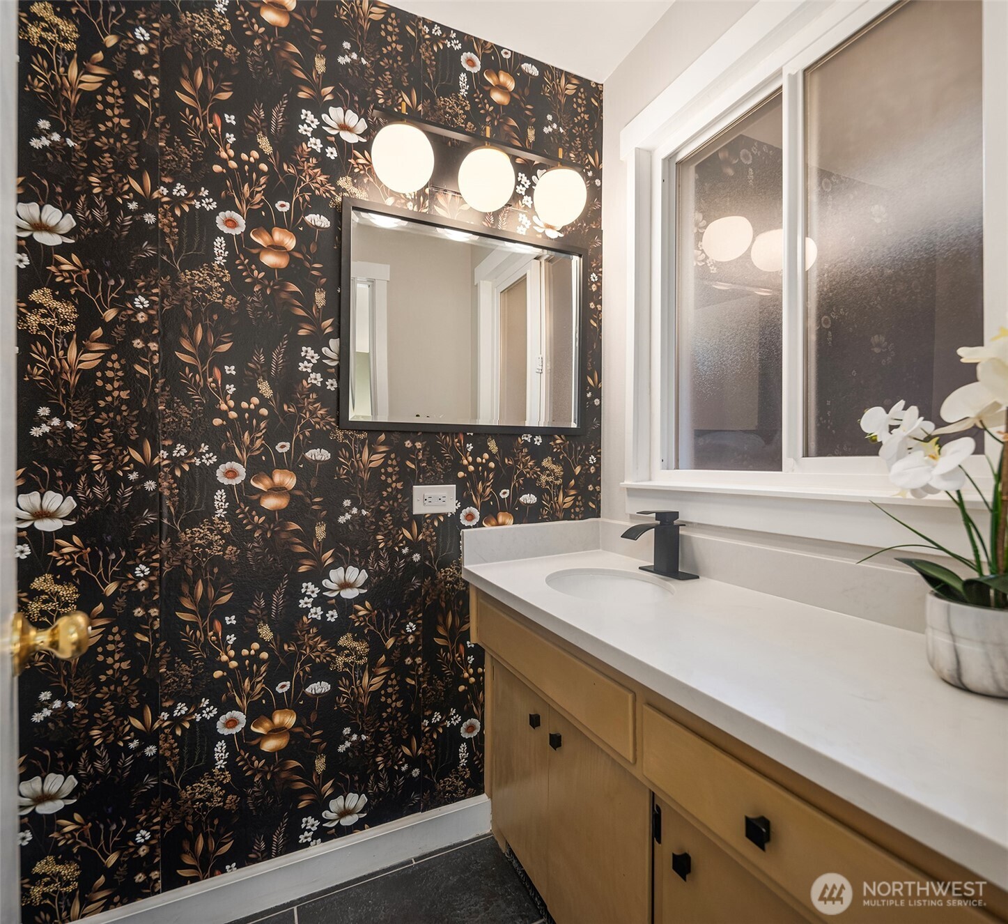 119 North 84th Street Seattle, WA 98103 - Photo 12 of 32 a bathroom with a sink and a mirror
