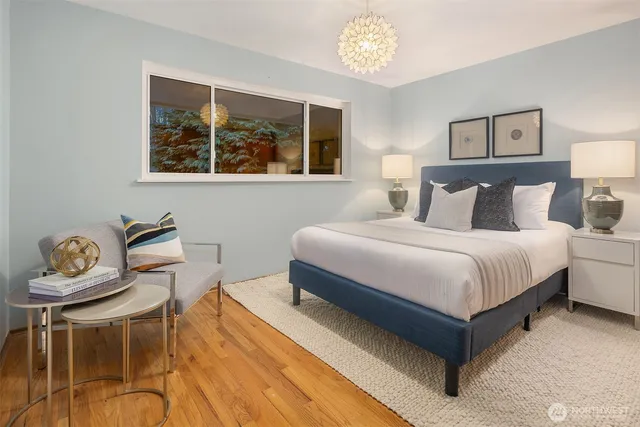 a bedroom with a bed and a table in it