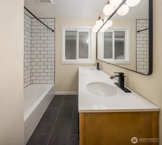 a bathroom with a sink and a bathtub