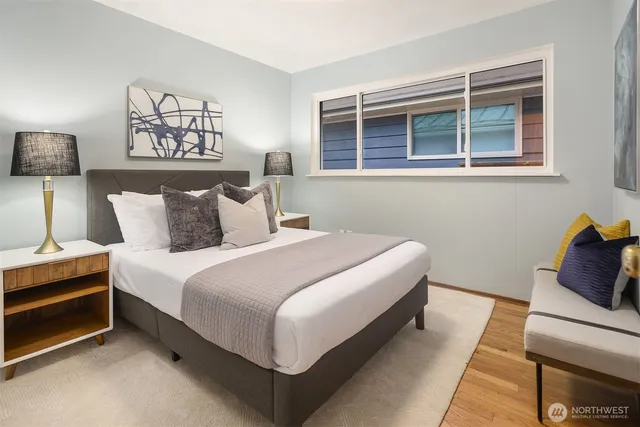 a bedroom with bed and a window