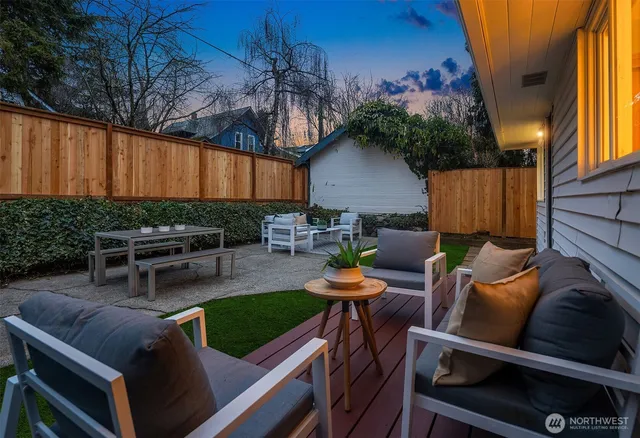a view of a chairs and tables in the back yard of the house