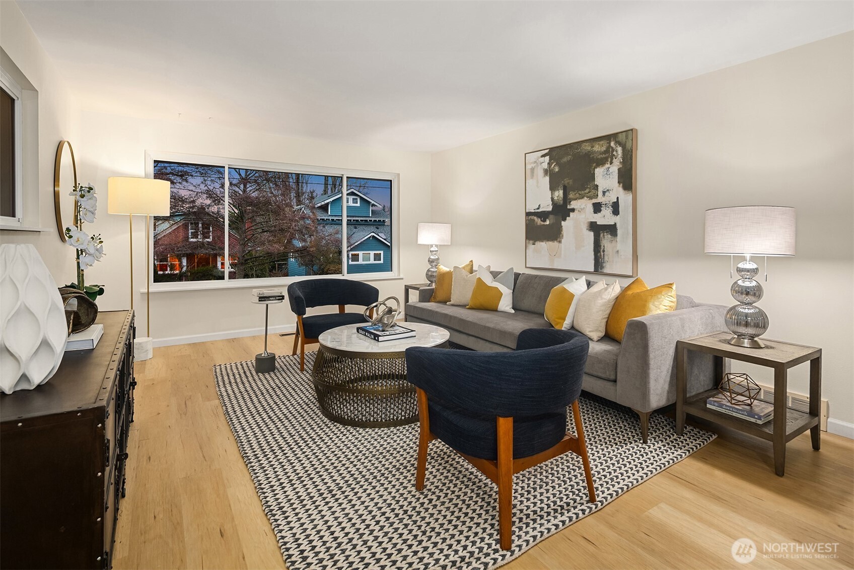 119 North 84th Street Seattle, WA 98103 - Photo 3 of 32 a living room with furniture a rug and a lamp
