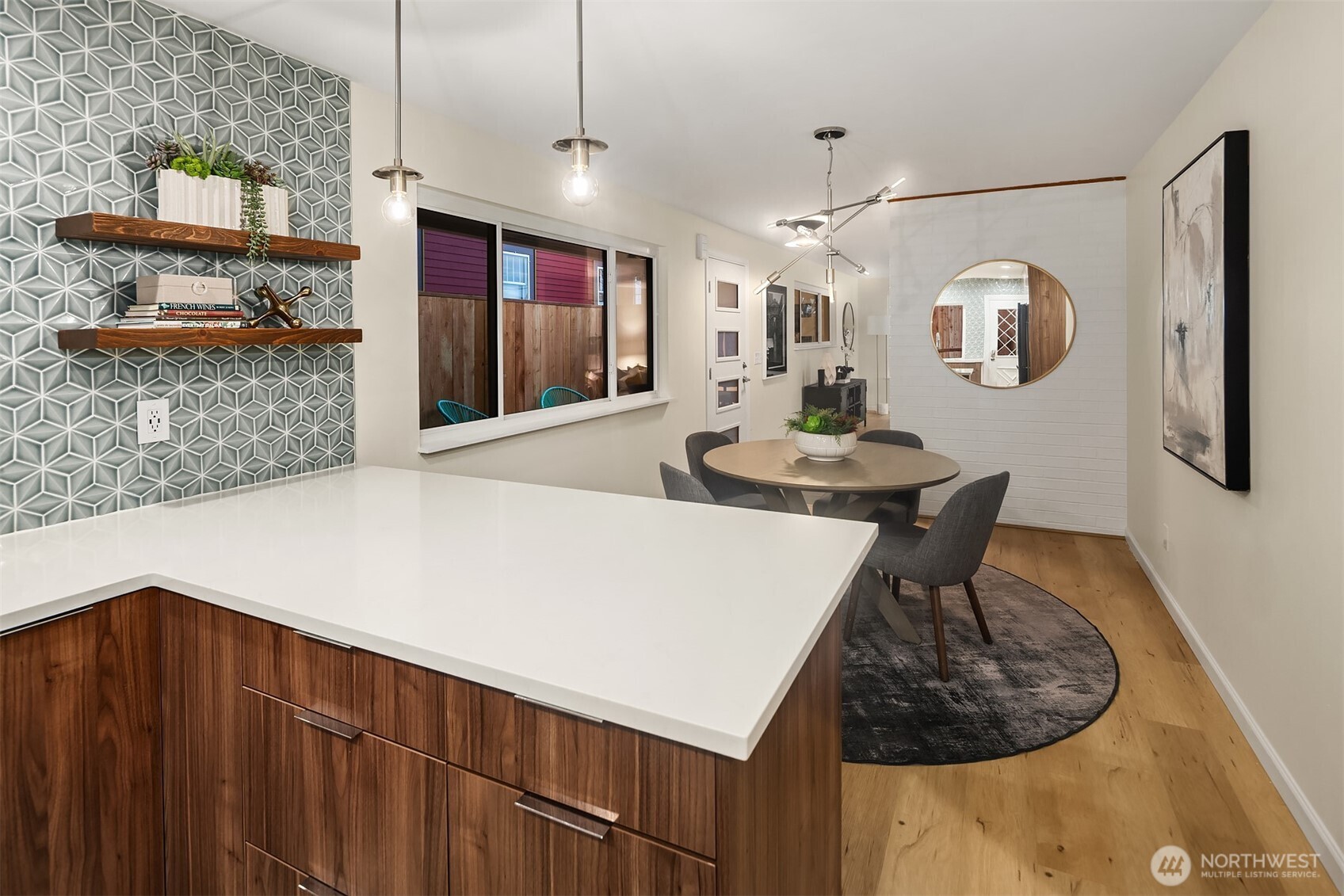 119 North 84th Street Seattle, WA 98103 - Photo 8 of 32 a kitchen with stainless steel appliances kitchen island a refrigerator and a stove