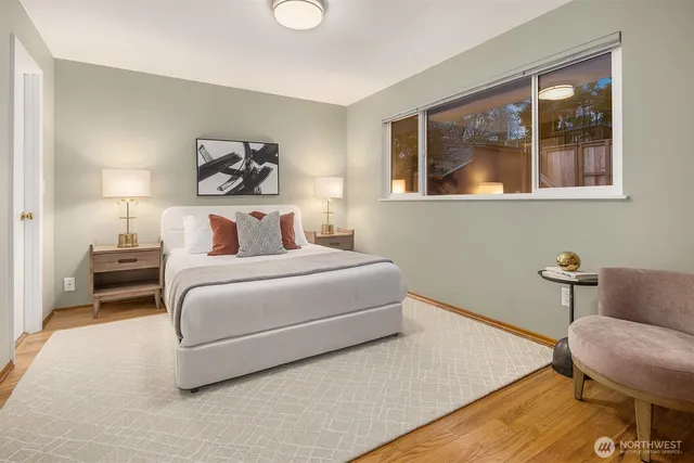 a bedroom with a bed and chair