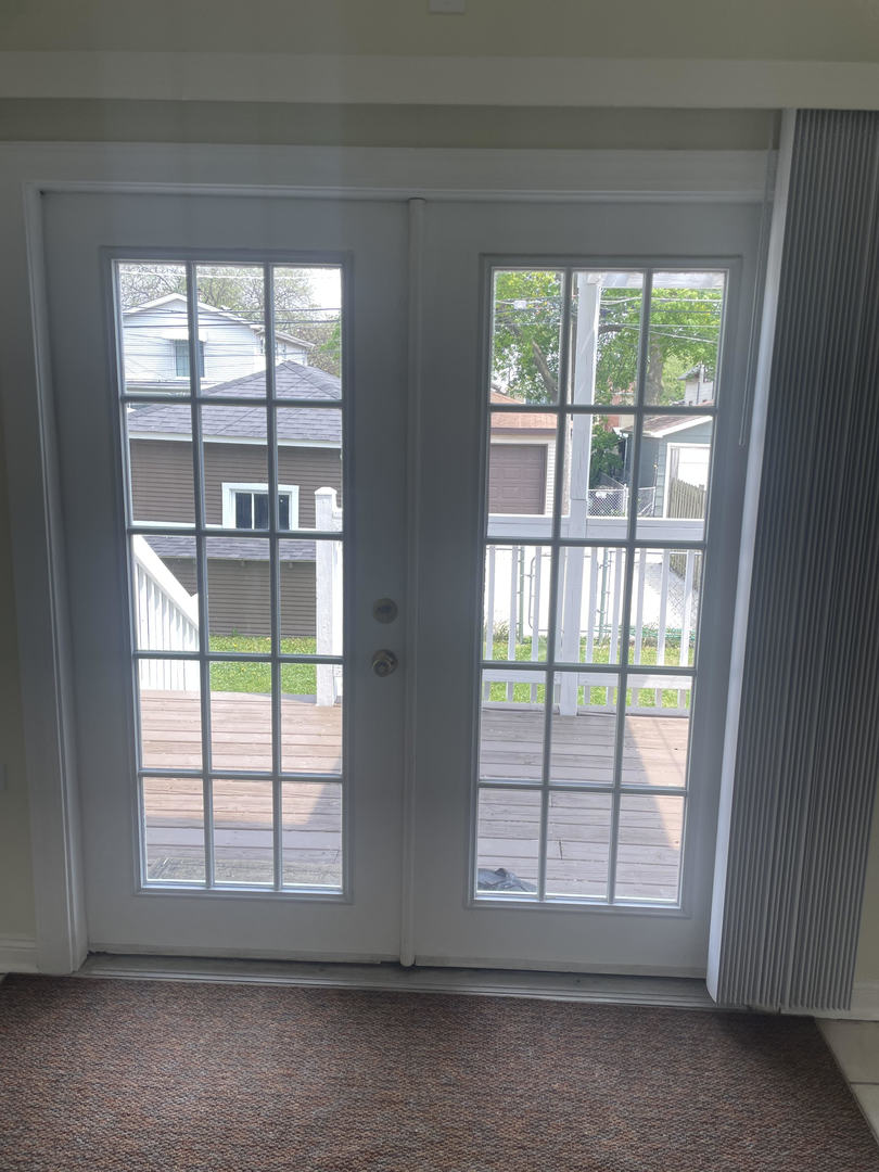 1436 Circle Avenue Forest Park, IL 60130 - Photo 7 of 18 an empty room with wooden floor and windows