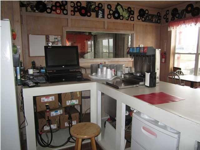 1054 Melton Road Baker, FL 32531 - Photo 11 of 34 a kitchen with a appliances cabinets and a counter top space