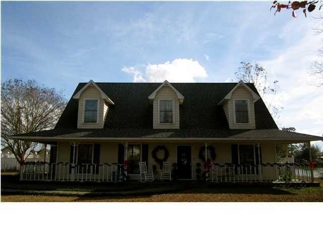 1054 Melton Road Baker, FL 32531 - Photo 15 of 34 a view of a black house with a fence