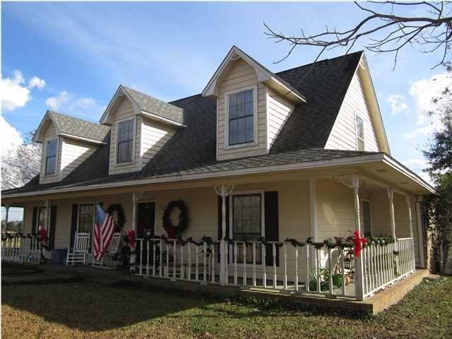 1054 Melton Road Baker, FL 32531 - Photo 16 of 34 a front view of a house with porch