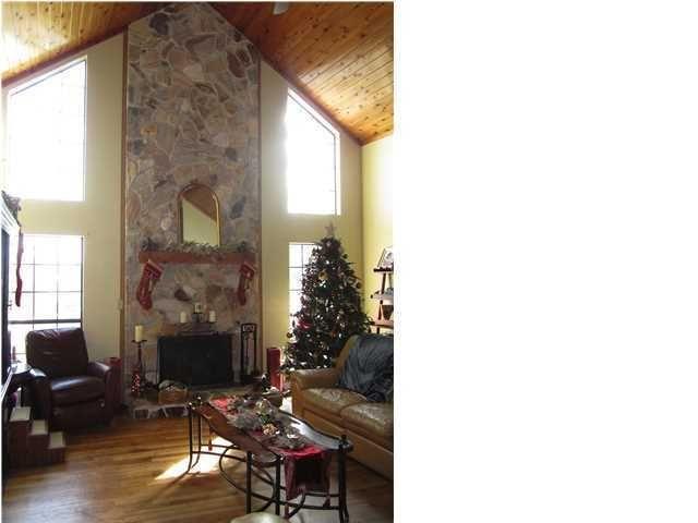 1054 Melton Road Baker, FL 32531 - Photo 17 of 34 a living room with furniture and a fireplace