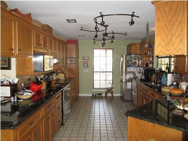 1054 Melton Road Baker, FL 32531 - Photo 21 of 34 a kitchen with sink cabinets and appliances