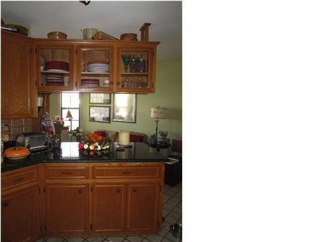 1054 Melton Road Baker, FL 32531 - Photo 25 of 34 a kitchen with a sink and cabinets