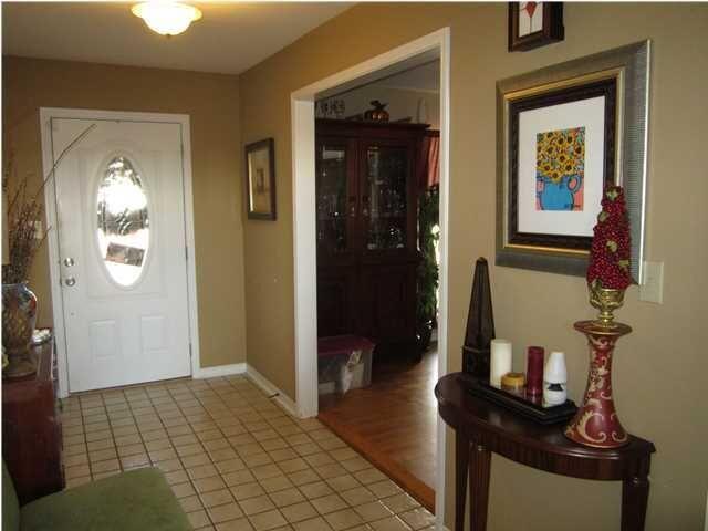 1054 Melton Road Baker, FL 32531 - Photo 26 of 34 a view of a hallway with wooden floor and windows