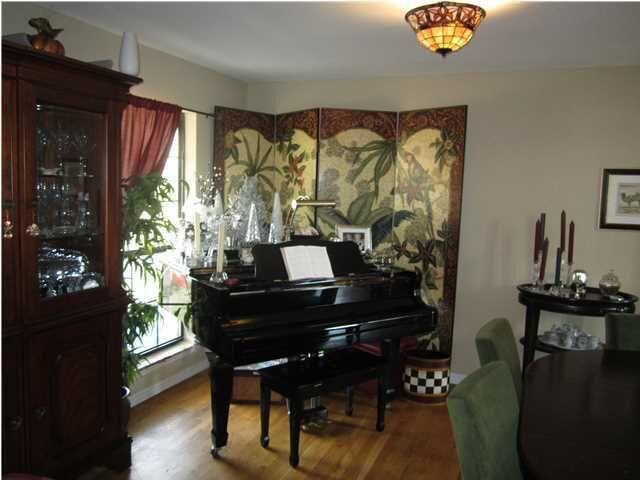 1054 Melton Road Baker, FL 32531 - Photo 27 of 34 a room with furniture and wooden floor