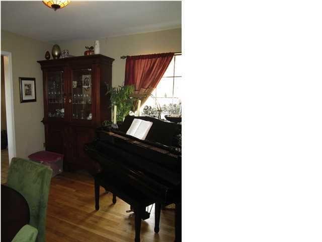 1054 Melton Road Baker, FL 32531 - Photo 28 of 34 a living room with furniture and wooden floor