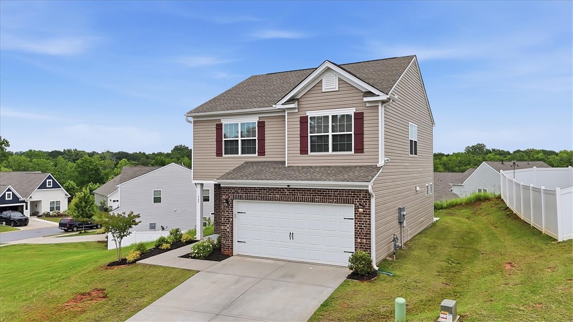365 Sliding Rock Drive Pendleton, SC 29670 - Photo 3 of 46 A well-maintained two-story residence with a front-facing garage, inviting brick accents, and a neat yard.