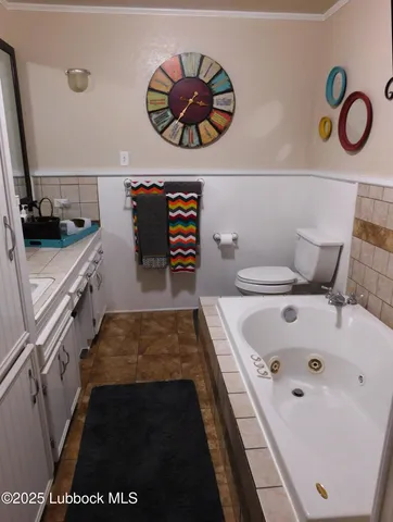 a bathroom with a bathtub and a sink