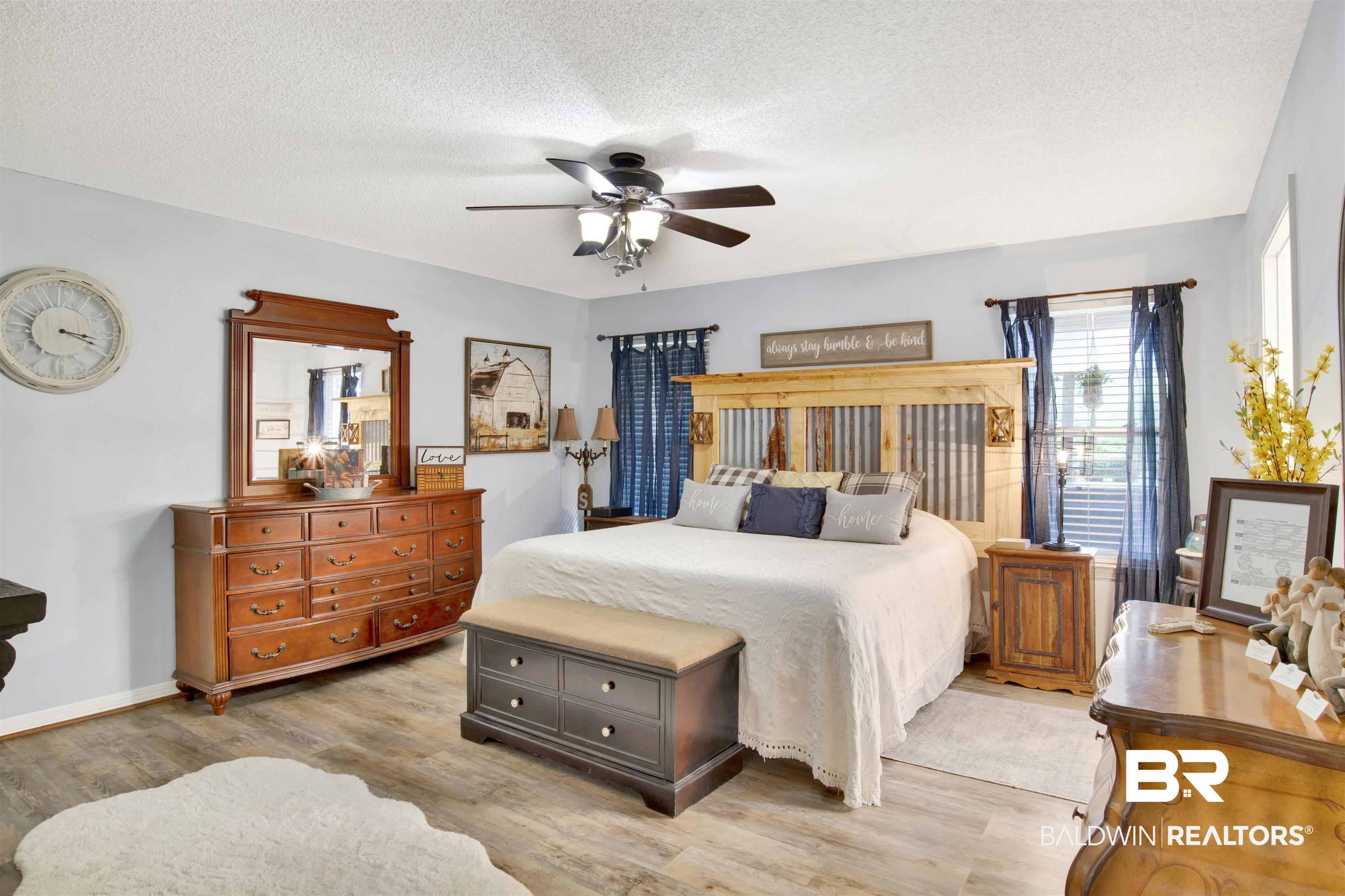 13385 Tom Gaston Road Mobile, AL 36695 - Photo 17 of 42 Bedroom with a textured ceiling, light hardwood / wood-style floors, and ceiling fan