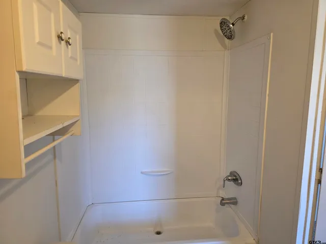 a view of a yard with large trees