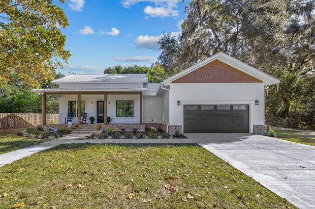 a front view of house with yard and seating area