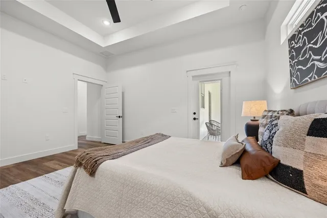 a bathroom with a sink a toilet a mirror and shower