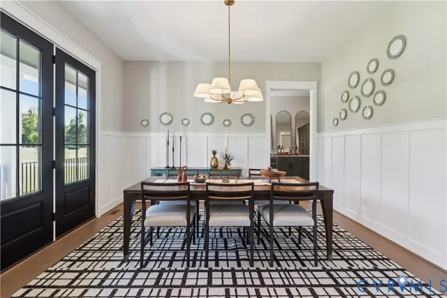 a kitchen with a table chairs stove and microwave