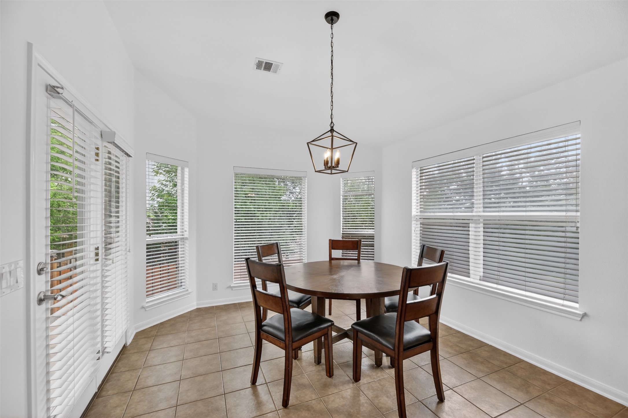 545 Manchester Lane Austin, TX 78737 - Photo 11 of 30 a view of a dining room with furniture window and outside view
