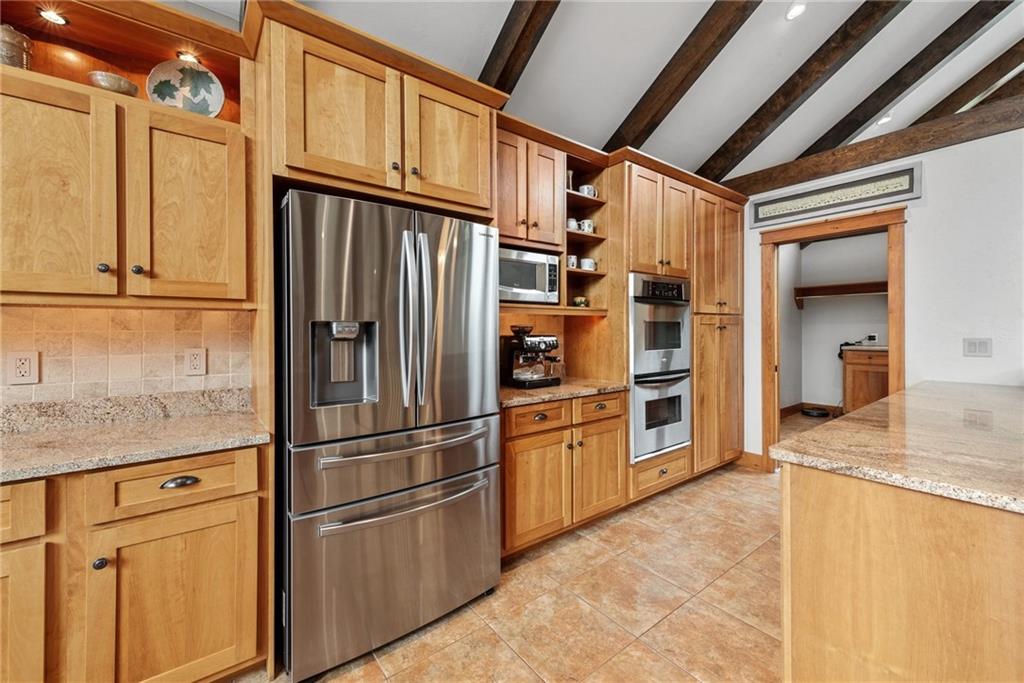 10126 Old Rte 56 Shelocta, PA 15774 - Photo 22 of 50 a kitchen with stainless steel appliances granite countertop a refrigerator and a sink