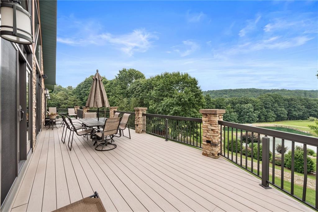 10126 Old Rte 56 Shelocta, PA 15774 - Photo 42 of 50 a view of a roof deck with table and chairs a barbeque with wooden floor and fence