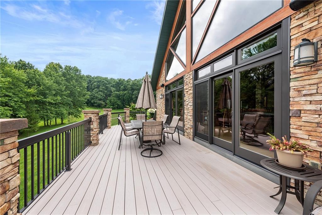 10126 Old Rte 56 Shelocta, PA 15774 - Photo 44 of 50 a view of a deck with table and chairs and wooden floor