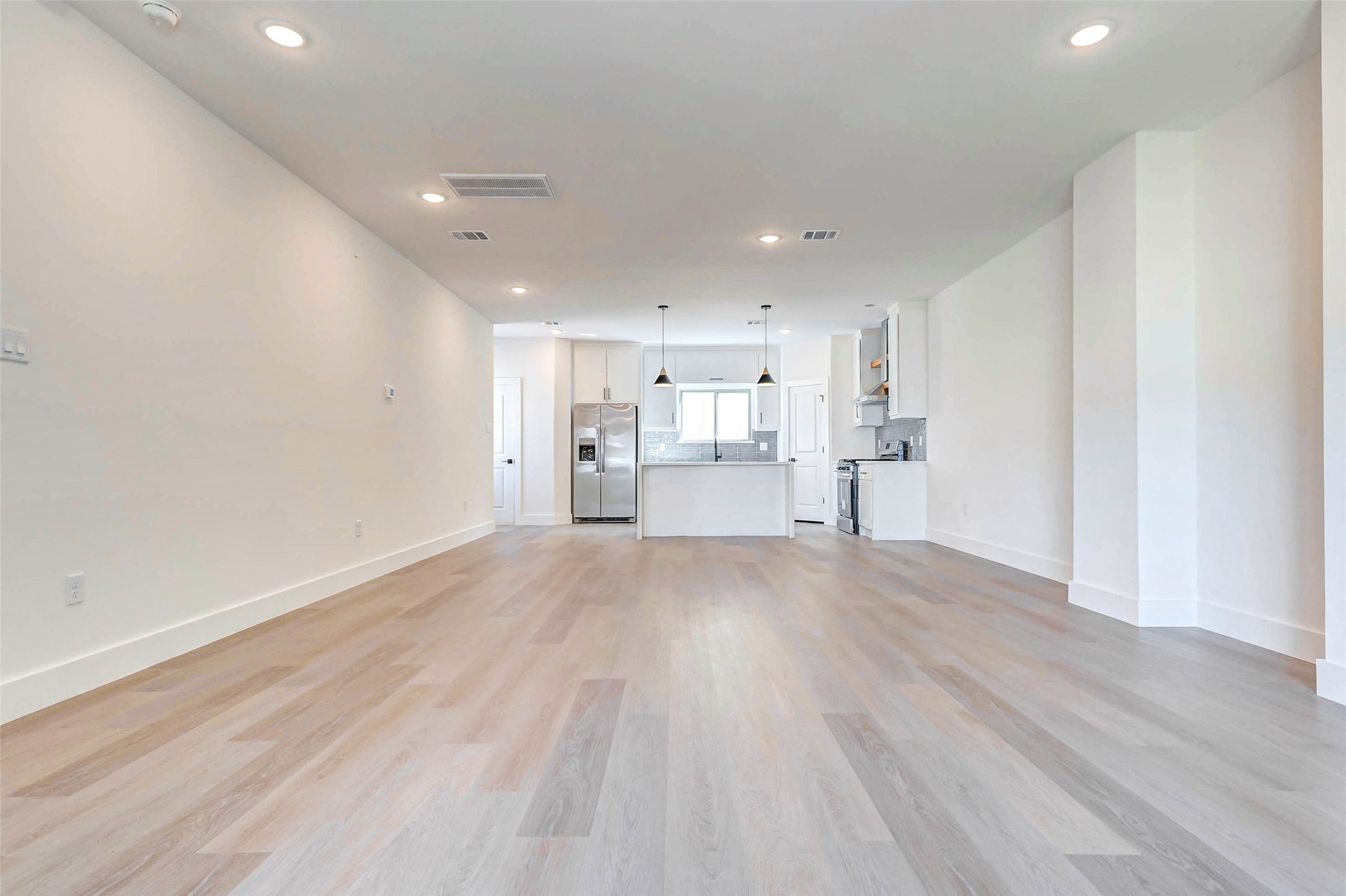 5638 Dolores Street Houston, TX 77057 - Photo 16 of 47 a view of a kitchen with a sink and wooden floor