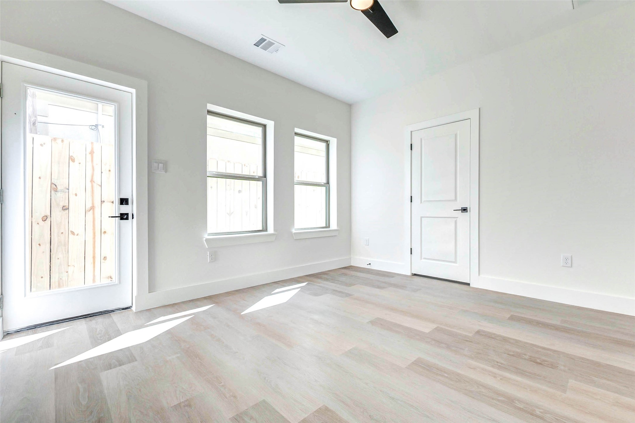 5638 Dolores Street Houston, TX 77057 - Photo 18 of 47 a view of an empty room with a window