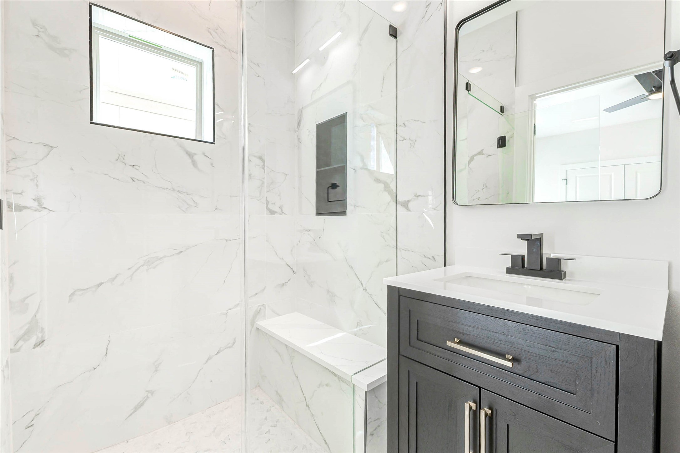 5638 Dolores Street Houston, TX 77057 - Photo 33 of 47 a bathroom with a sink vanity granite and a mirror