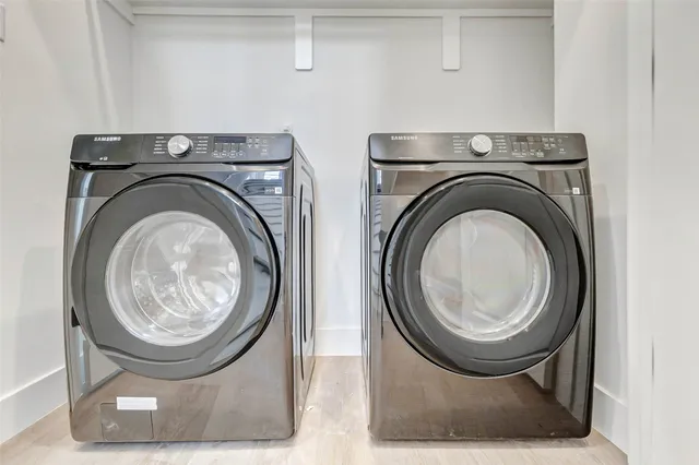 a utility room with dryer and washer
