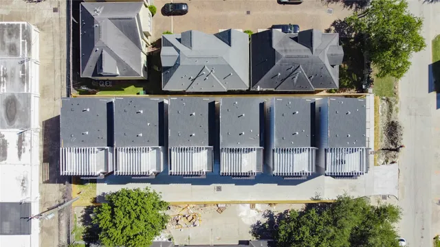 an aerial view of a house with swimming pool