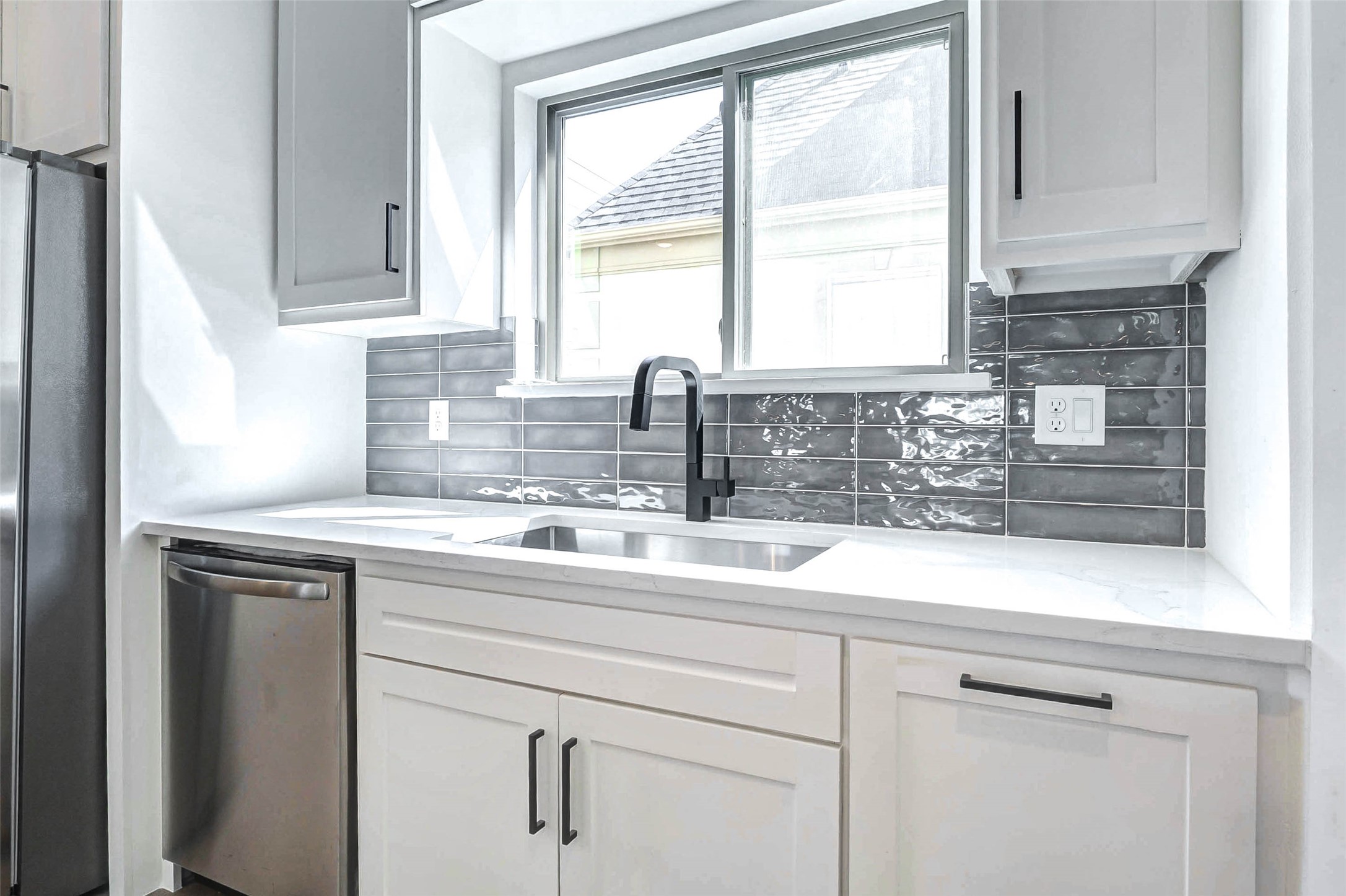 5638 Dolores Street Houston, TX 77057 - Photo 9 of 47 a kitchen with a sink and cabinets