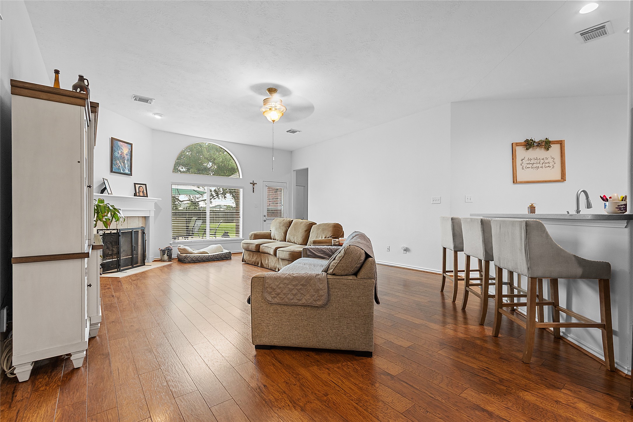 21014 Jessica Rose Lane Spring, TX 77379 - Photo 5 of 30 a living room with furniture wooden floor and a chandelier