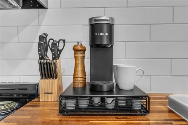 a bathroom with a sink and a washer dryer