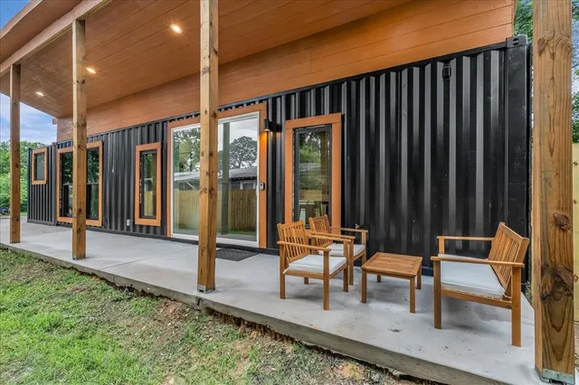 a view of two chairs in the patio