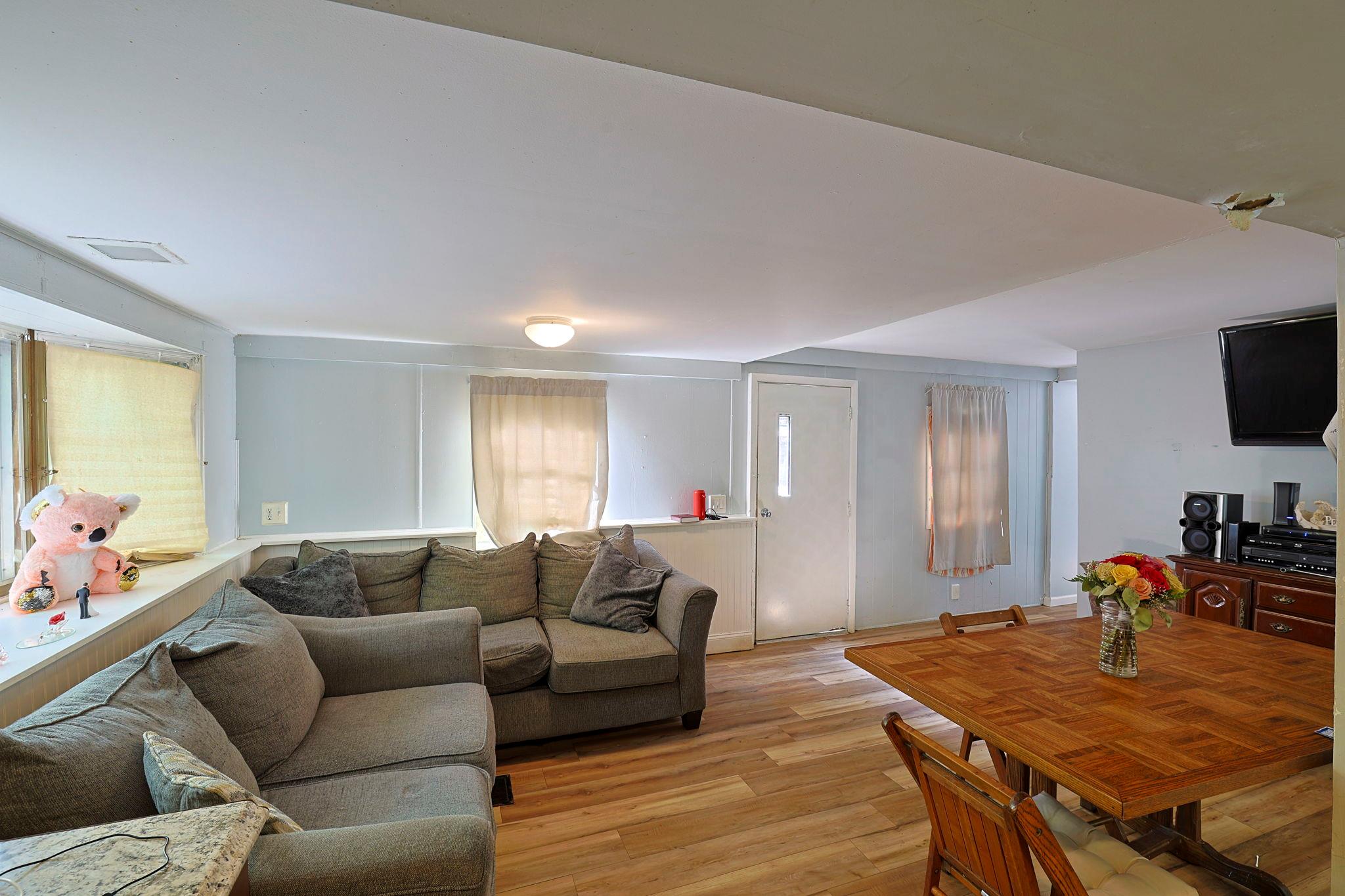181 Oak Ridge Road Greenfield Park, NY 12435 - Photo 12 of 22 Living room featuring visible vents, light wood-type flooring, and baseboards